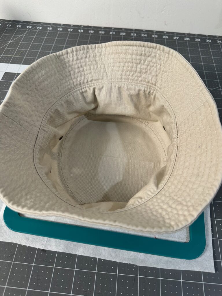 hat inside out stuck to hoop for embroider