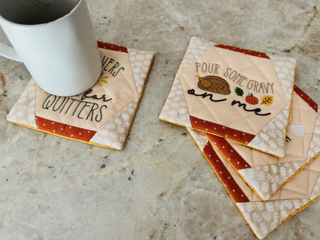 Finished Thanksgiving Coasters with coffee cup