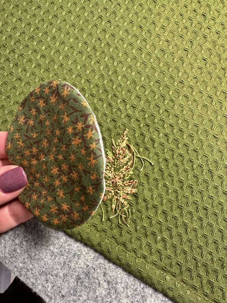 placing patch over embroidery wrong side