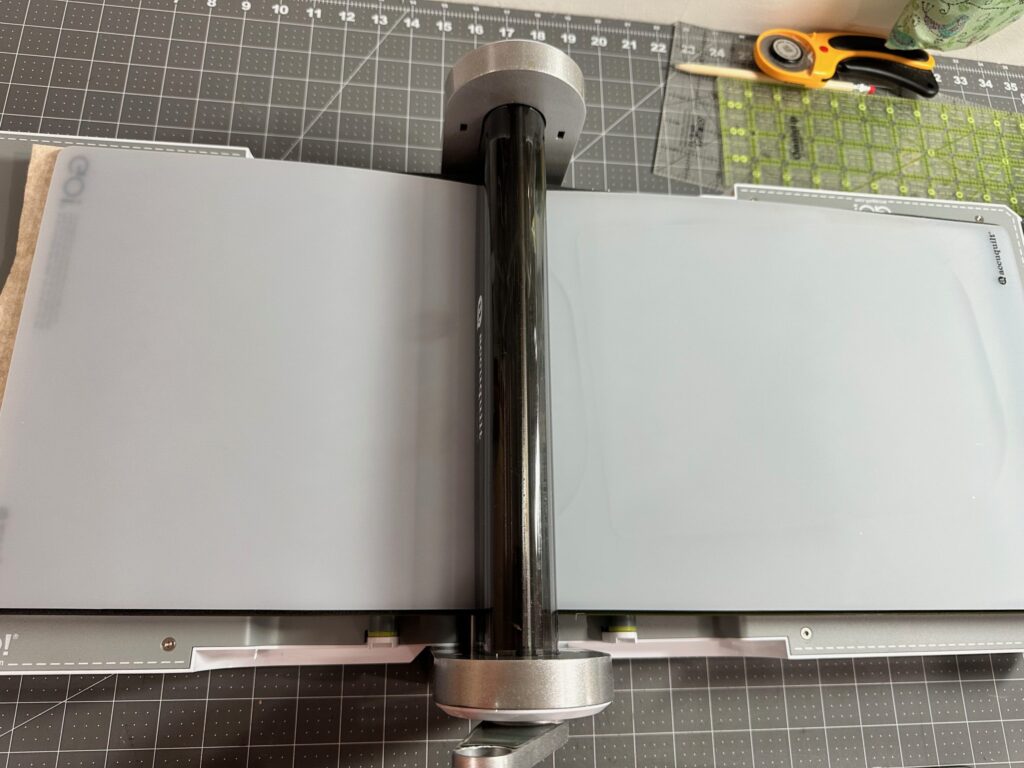 cutting mat over Kraft-tex and cutting Lucky Penny Die