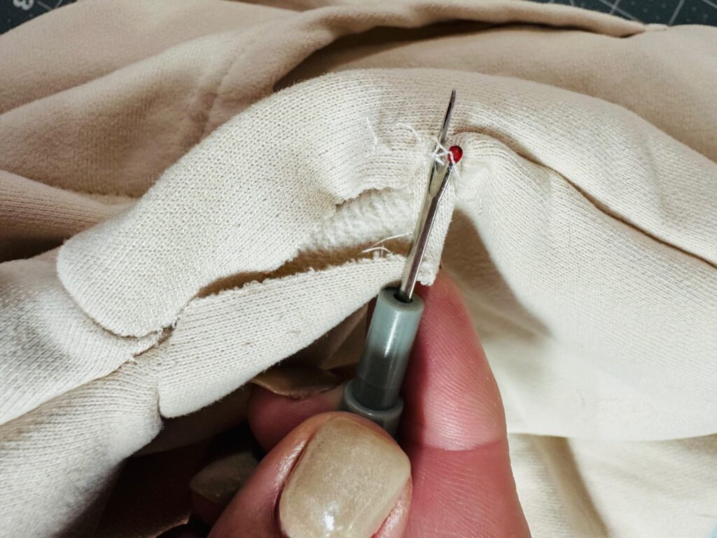 removing stitching from inside sweatshirt