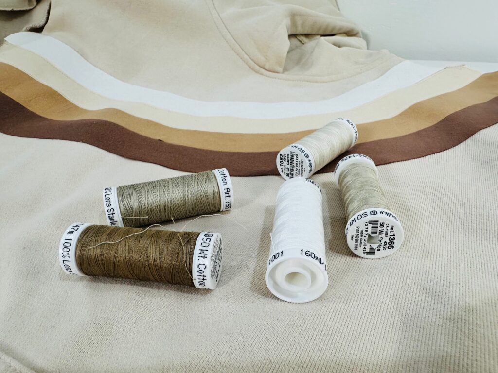 matching threads on top of sweatshirt appliqués