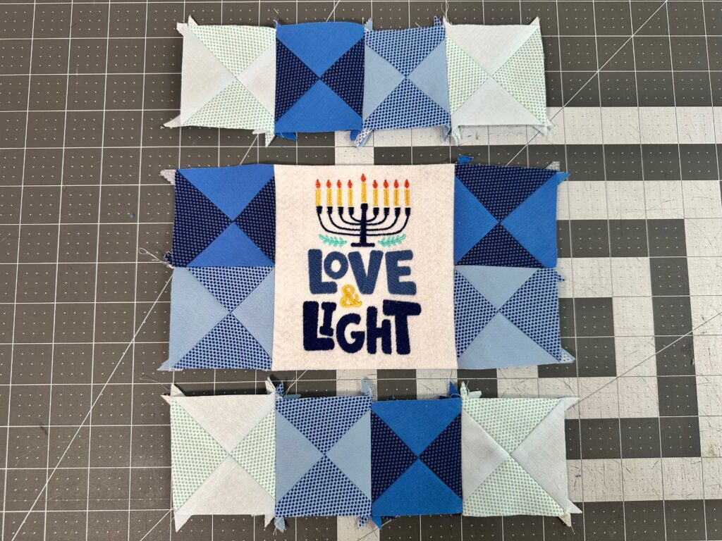 stitch side blocks to center embroidery