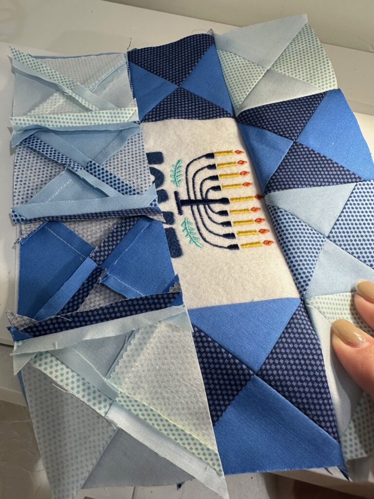 stitch lower border last for Hanukkah shelf pillow