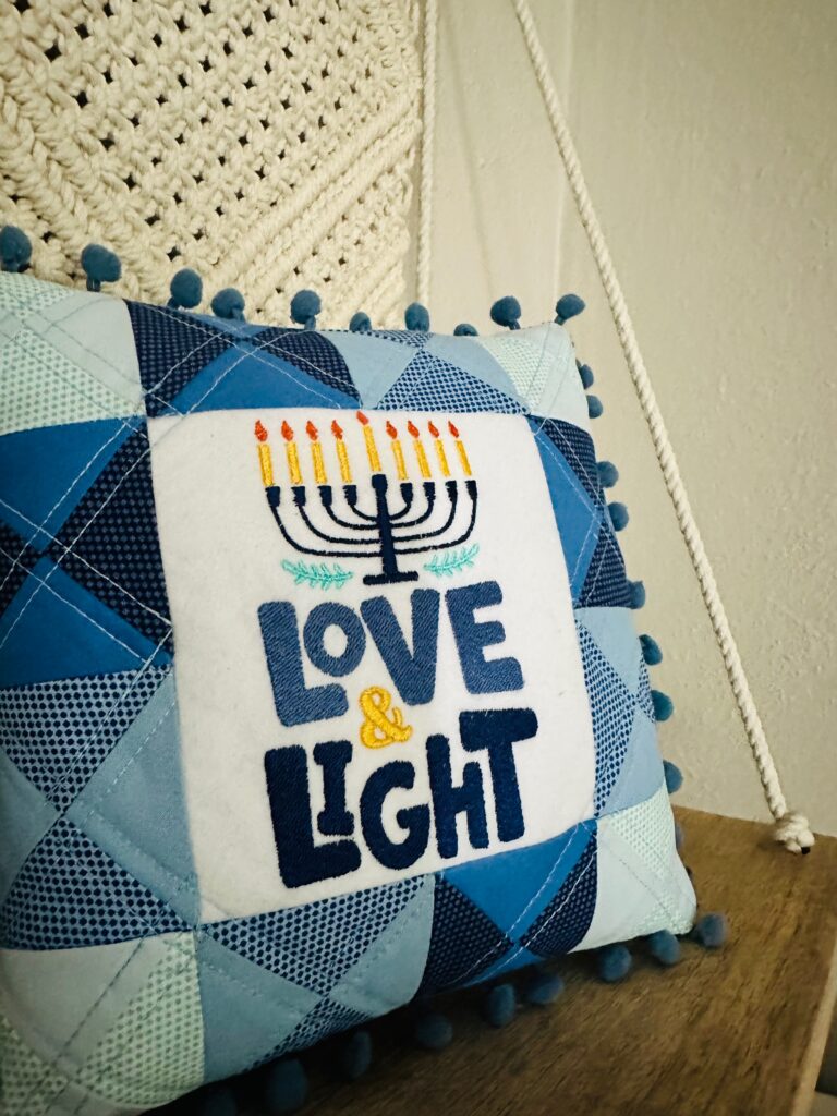 Hanukkah Shelf Pillow on shelf