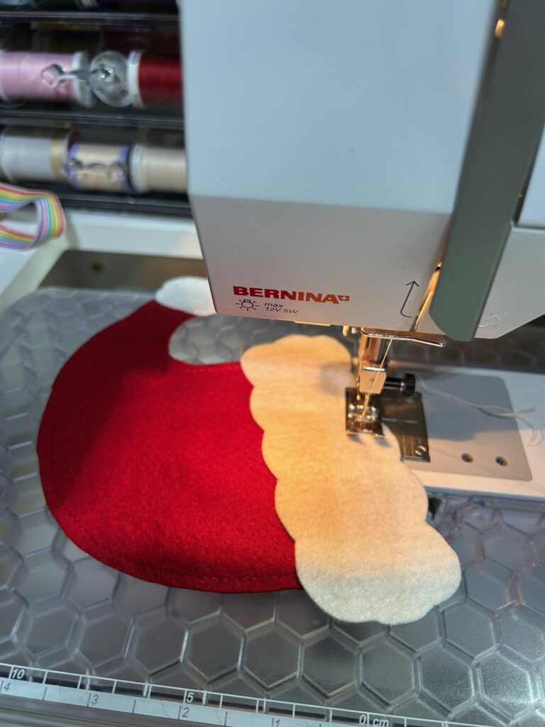 stitching Santa's hat