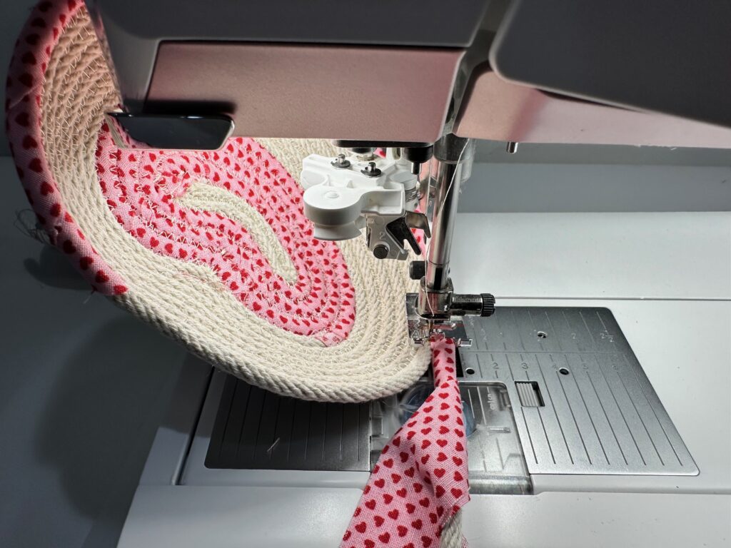 adding more fabric to wrap rope as you sew