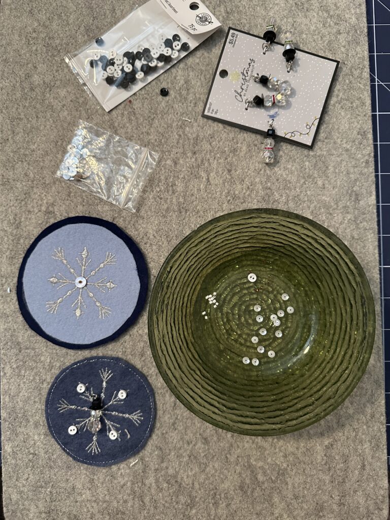 embellishing snowflake ornaments with sequins and beads