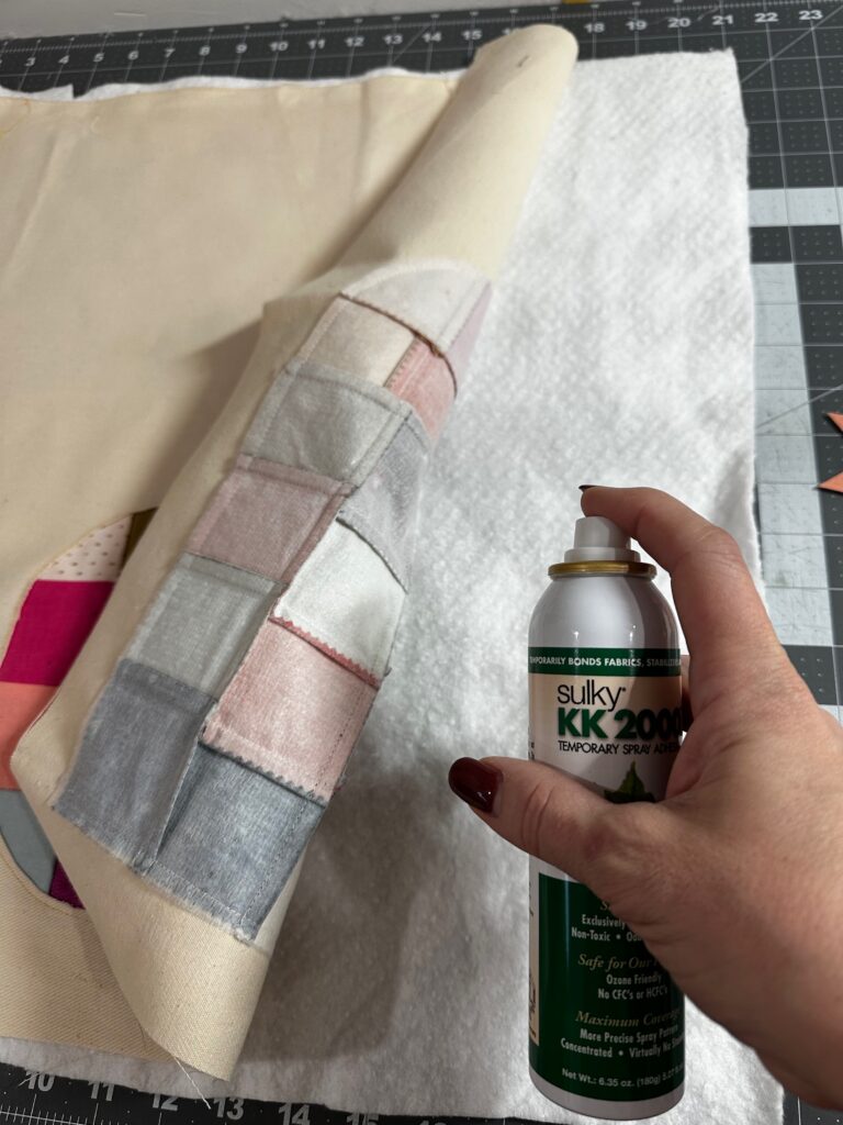 securing fabric to batting