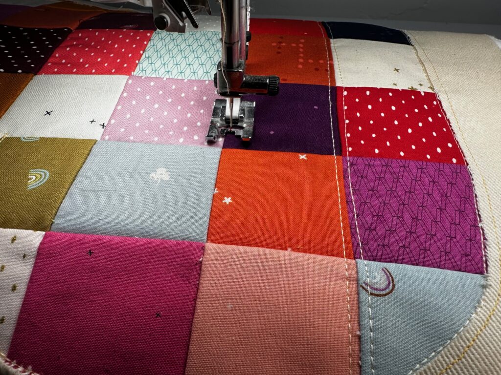 quilting along the heart patchwork