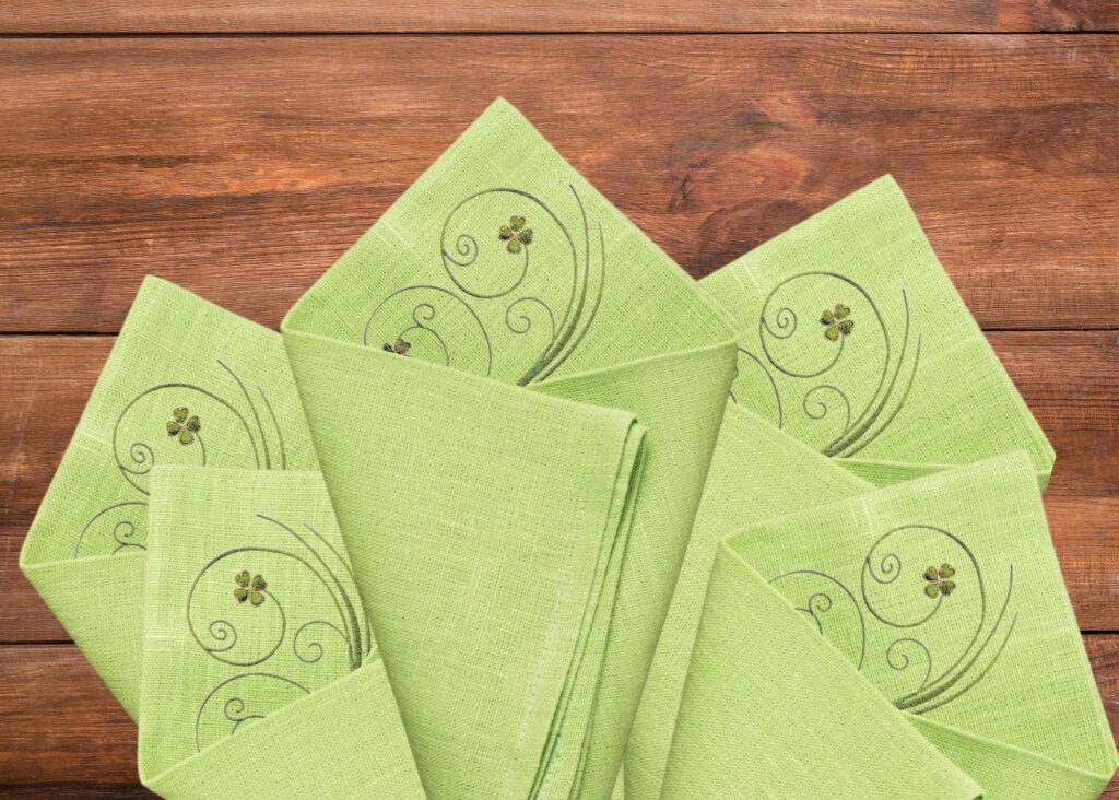 four leaf clover flourish on green napkin grouping