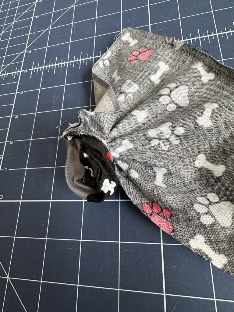turning bandana right side out through one open end