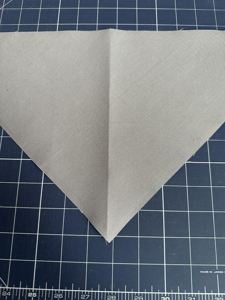 crease fabric triangle for design positioning on bandana