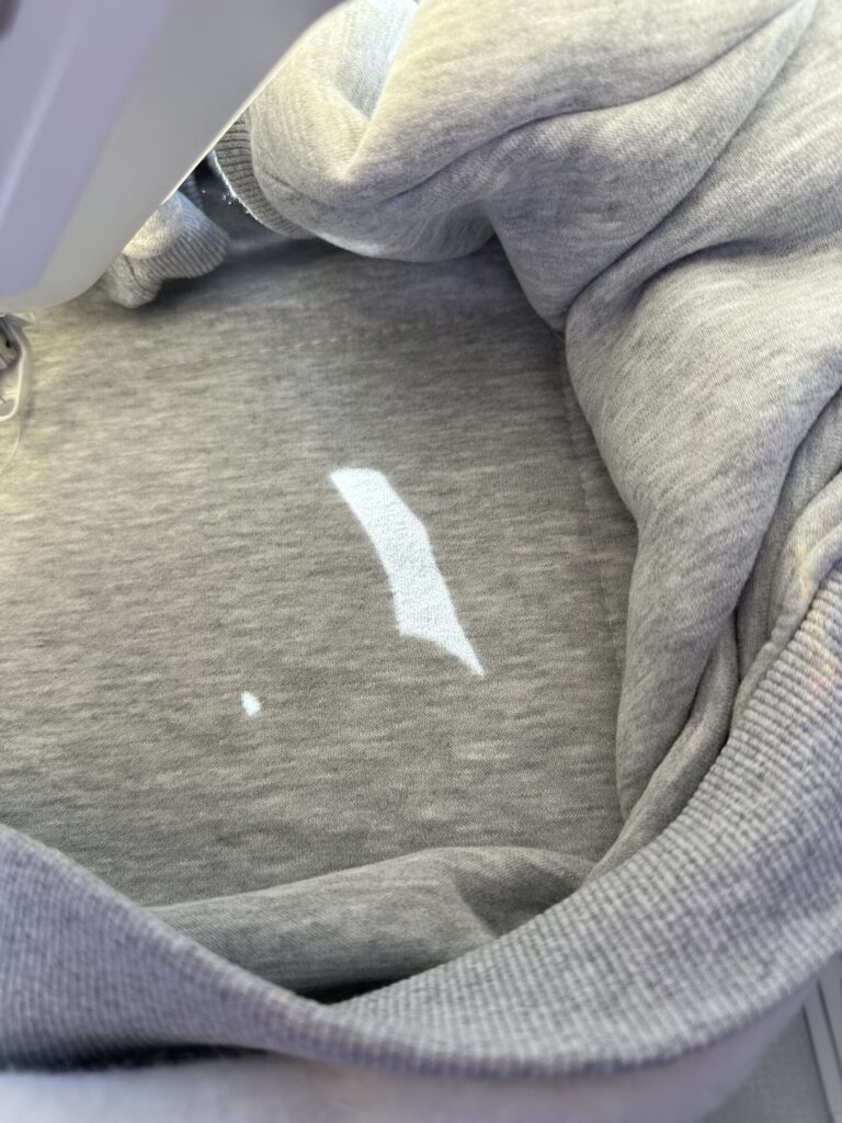 add Solvy topper over sweatshirt after placing on hooped stabilizer