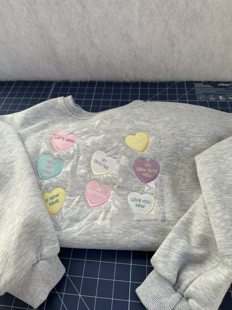 sweatshirt out of hoop with solvy still attached