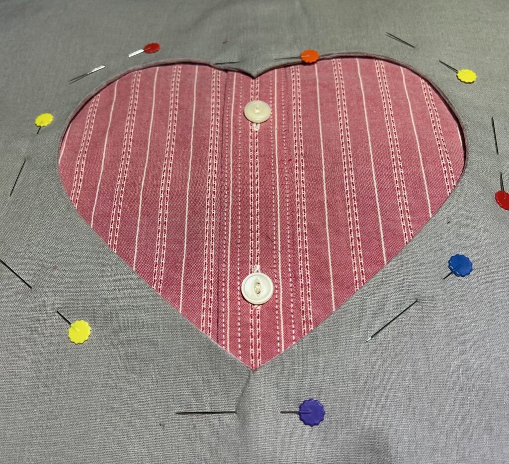 center shirt within heart opening on exterior fabric