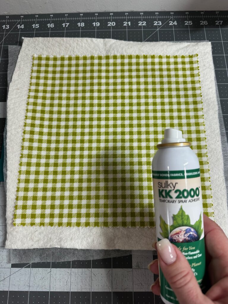 placing fabric over batting in the hoop