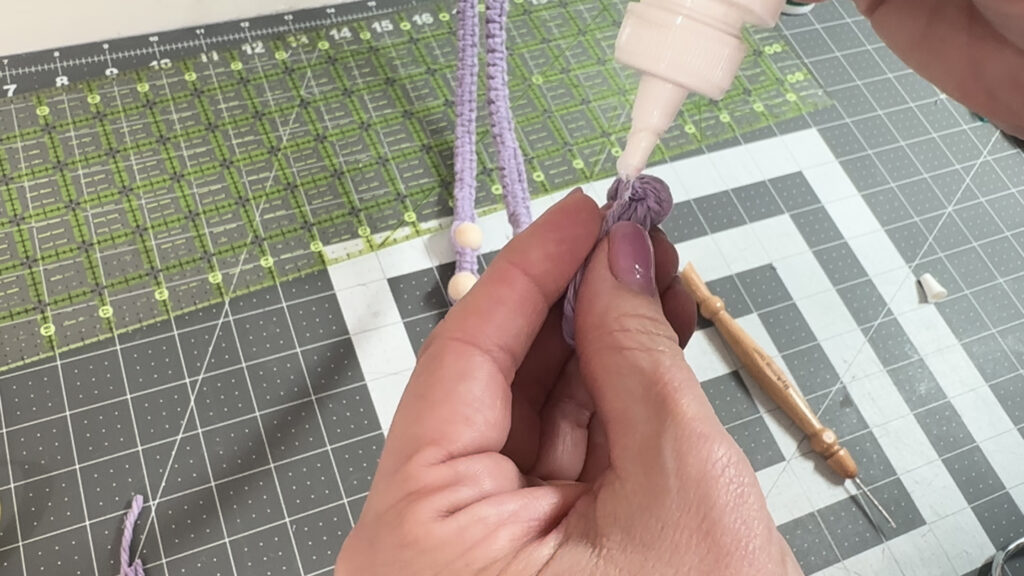 applying fray check to cord ends