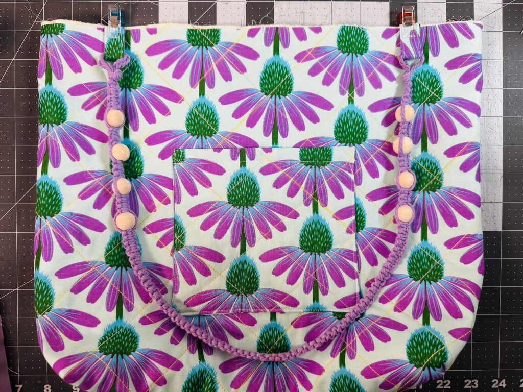 placing Handle Connector ends on quilted tote front