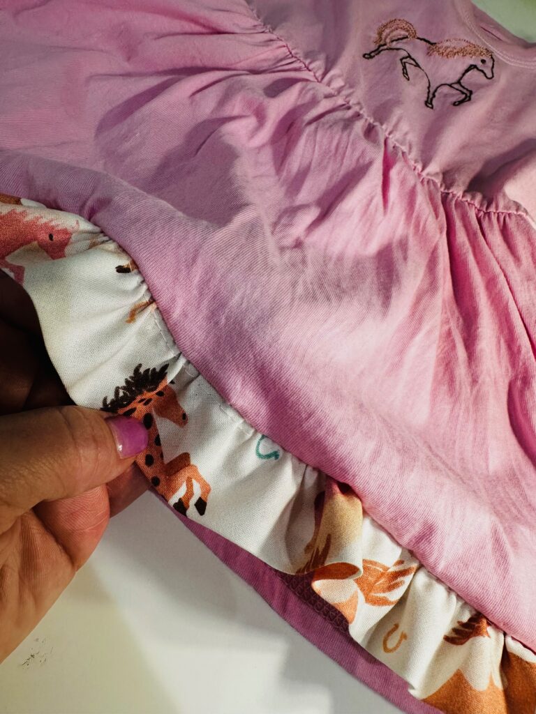 folding ruffle toward hem edge