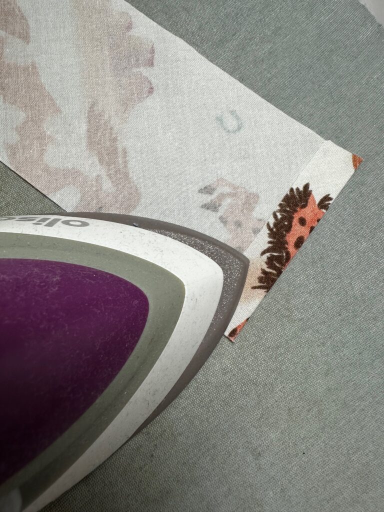 pressing end of ruffle to wrong side