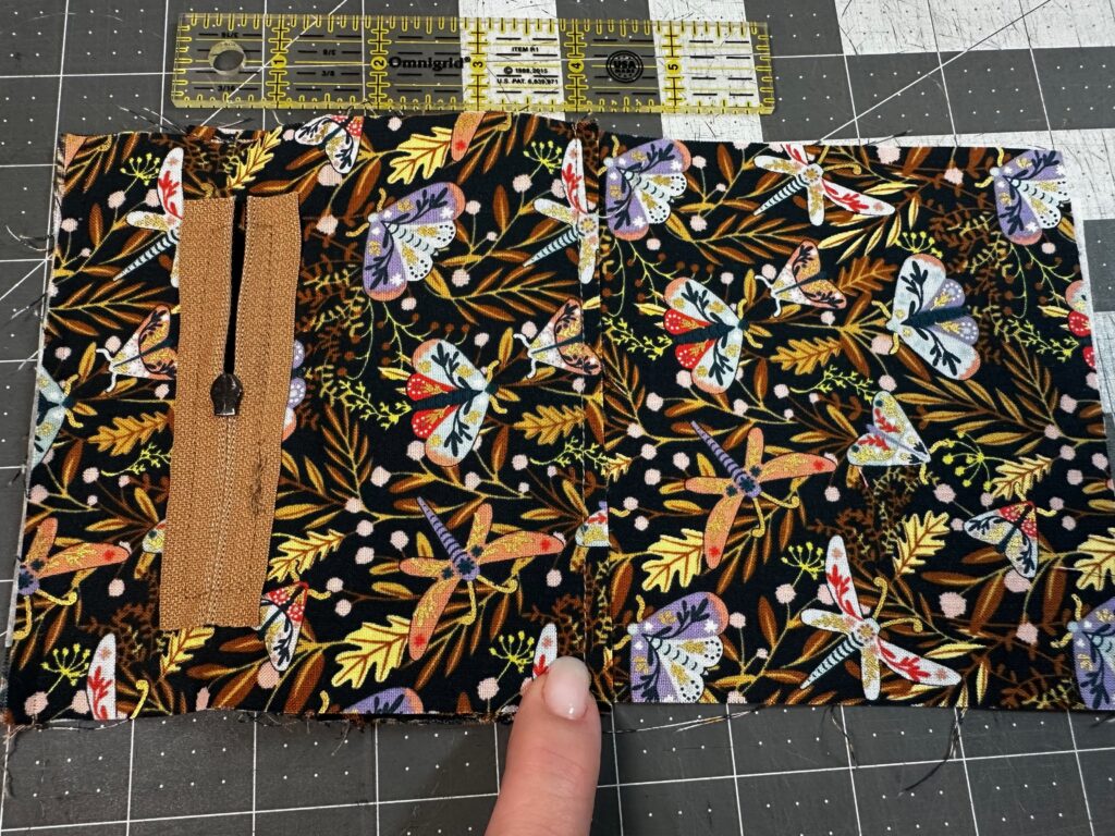 placing zipper pocket on coin purse assembly