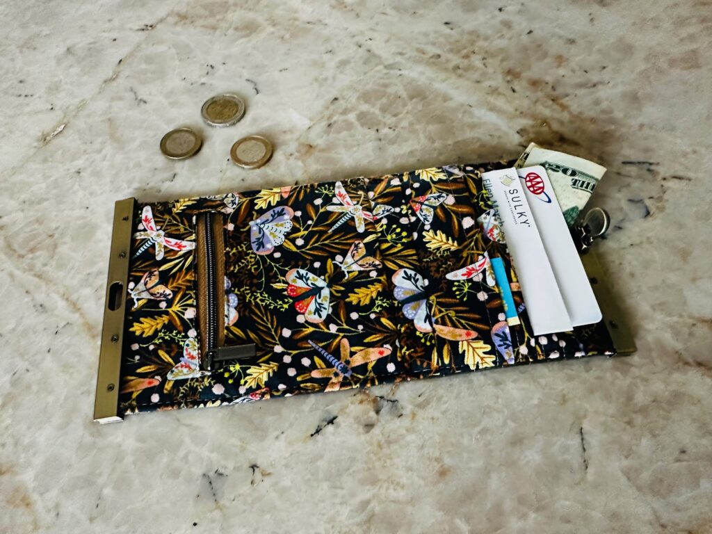 frame coin purse wallet open on table