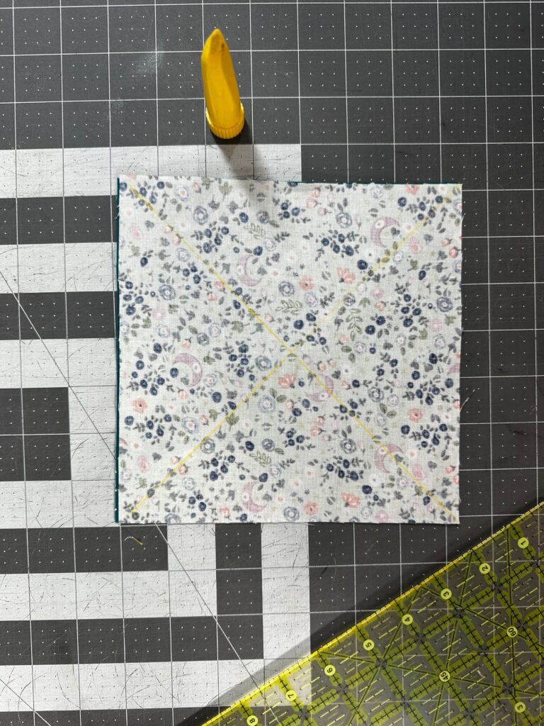 two fabrics to make two pinwheel blocks