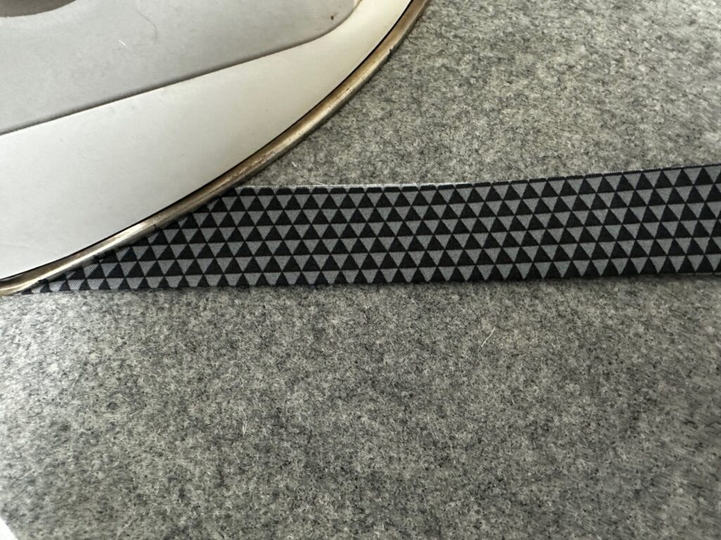 folding lanyard fabric in half and pressing