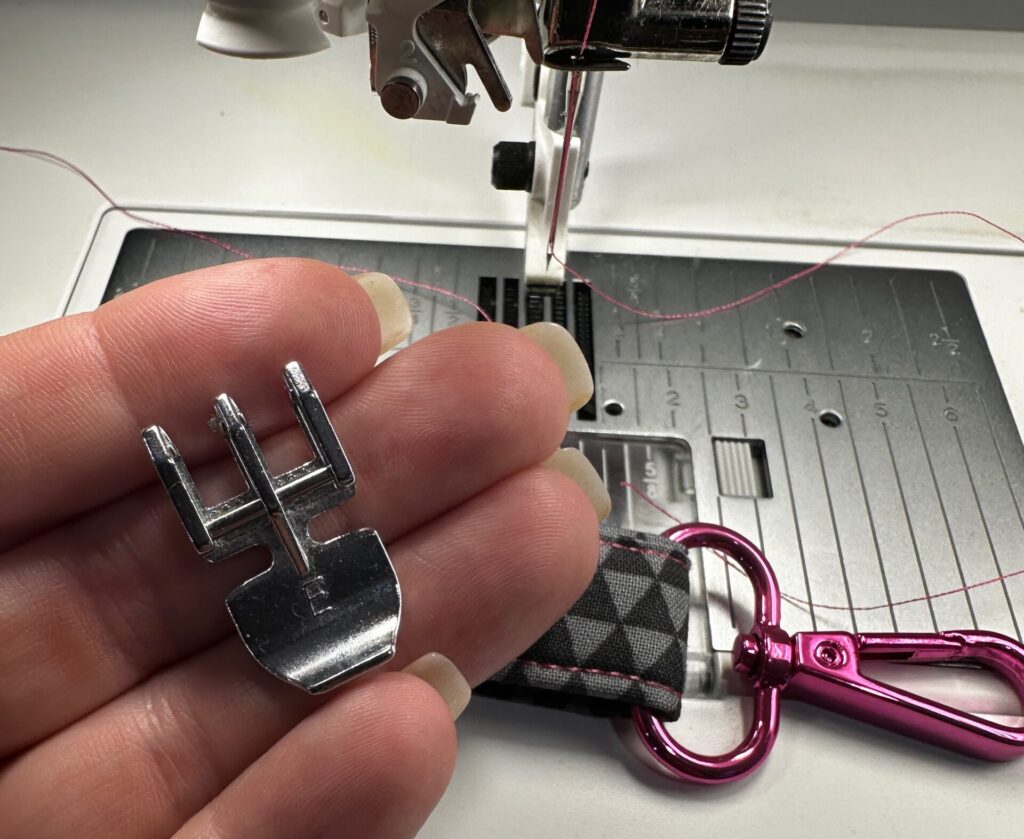 using zipper foot to stitch close to D-ring swivel clip