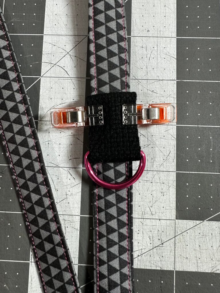 placement of d-ring webbing loop on lanyard