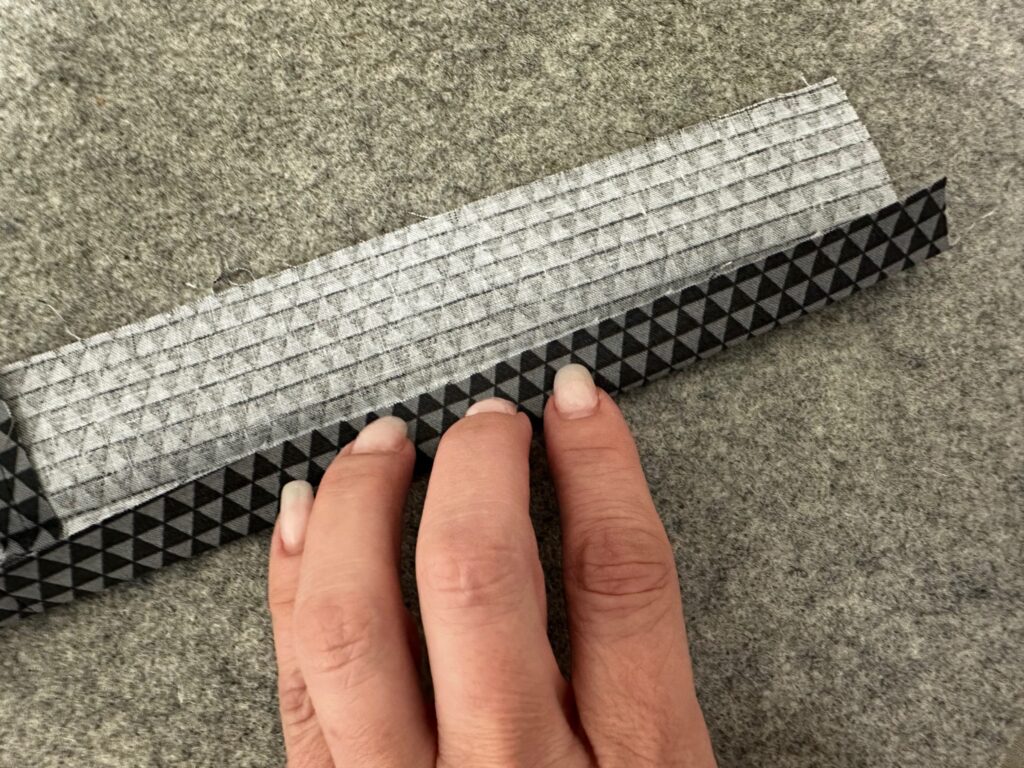 unfolding lanyard fabric along one long edge