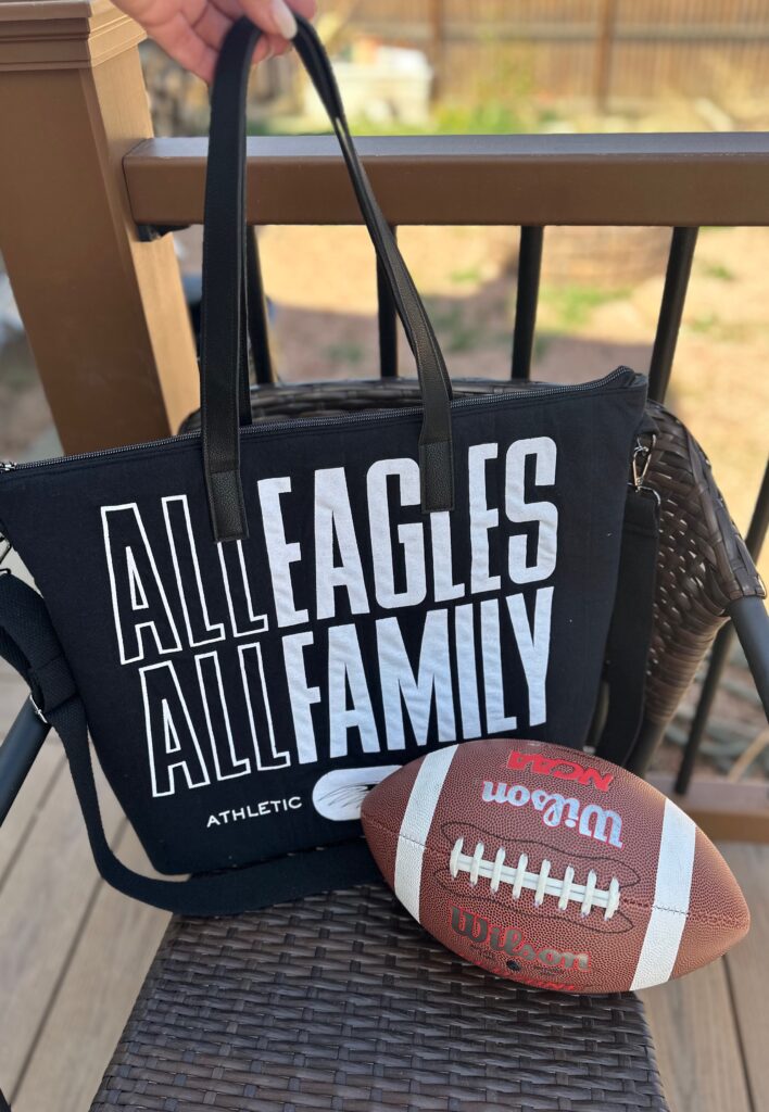 t-shirt tote with football outside on a chair