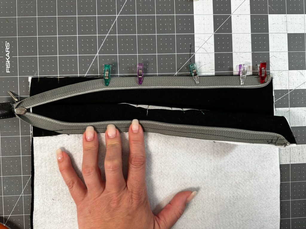 clipping opposite zipper tape edge