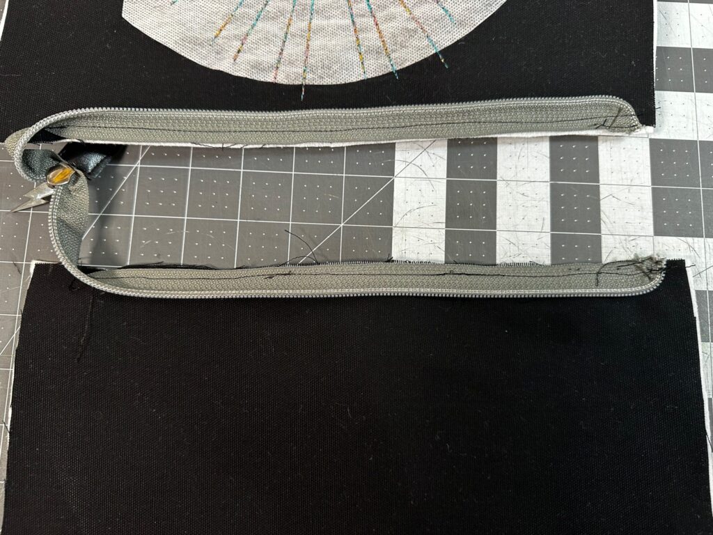both zipper edges stitched