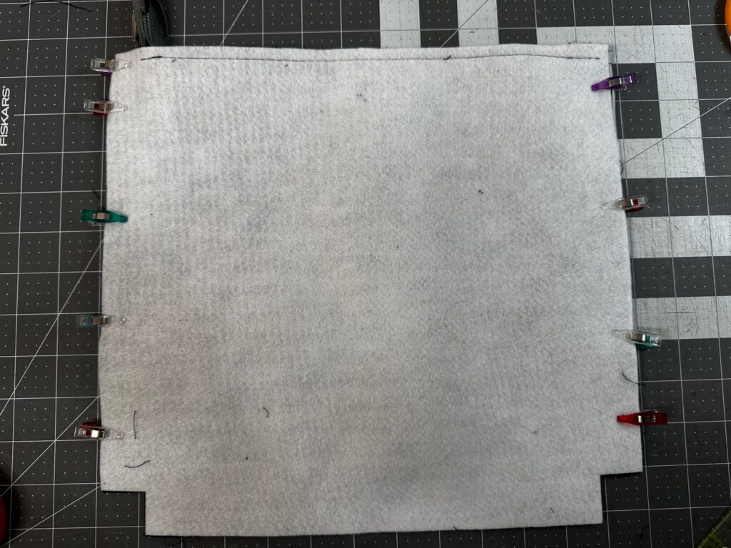 side seams clipped of exterior zip pouch
