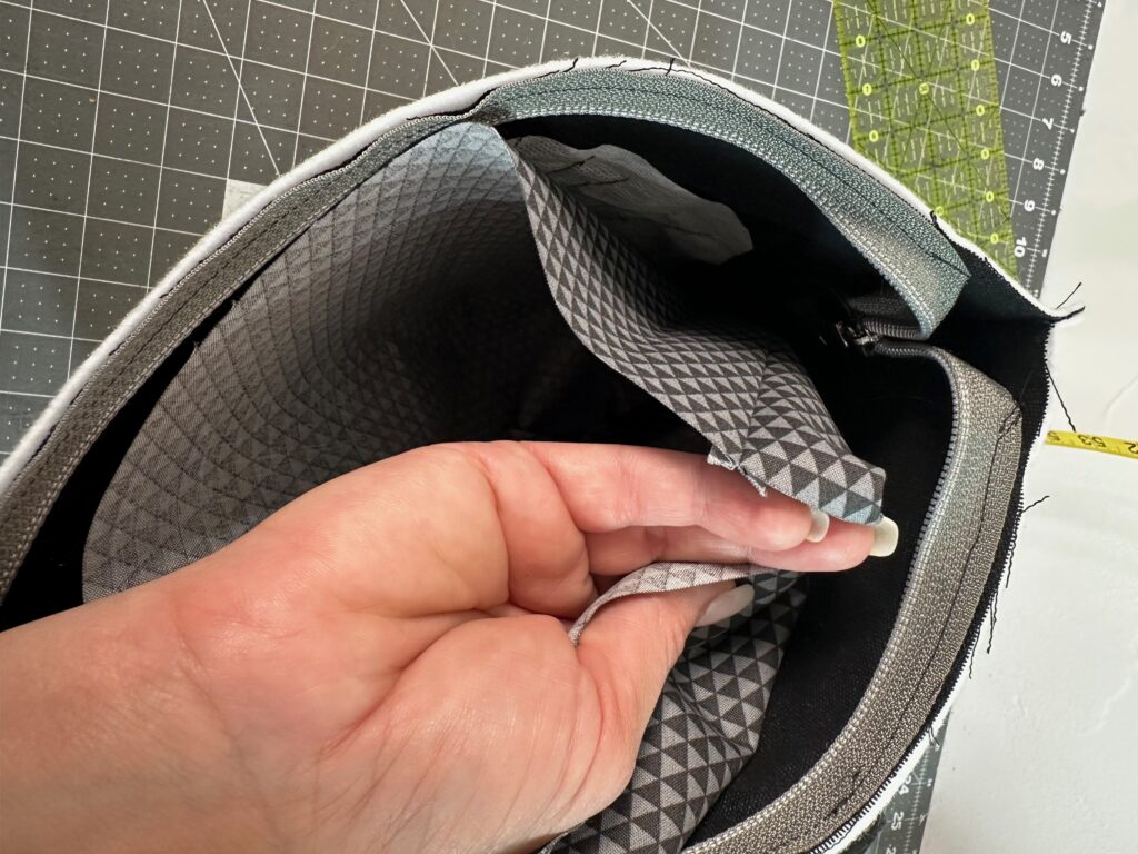 insert lining into exterior pouch