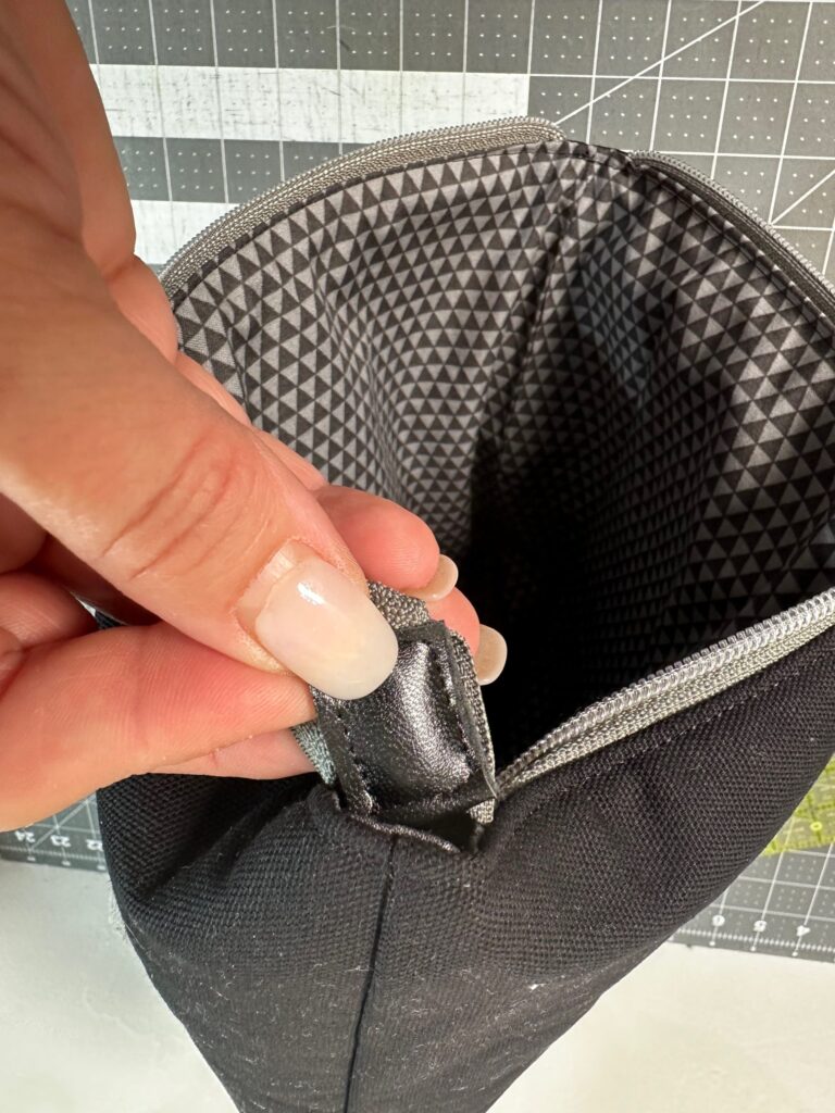 pushing zipper end into pouch