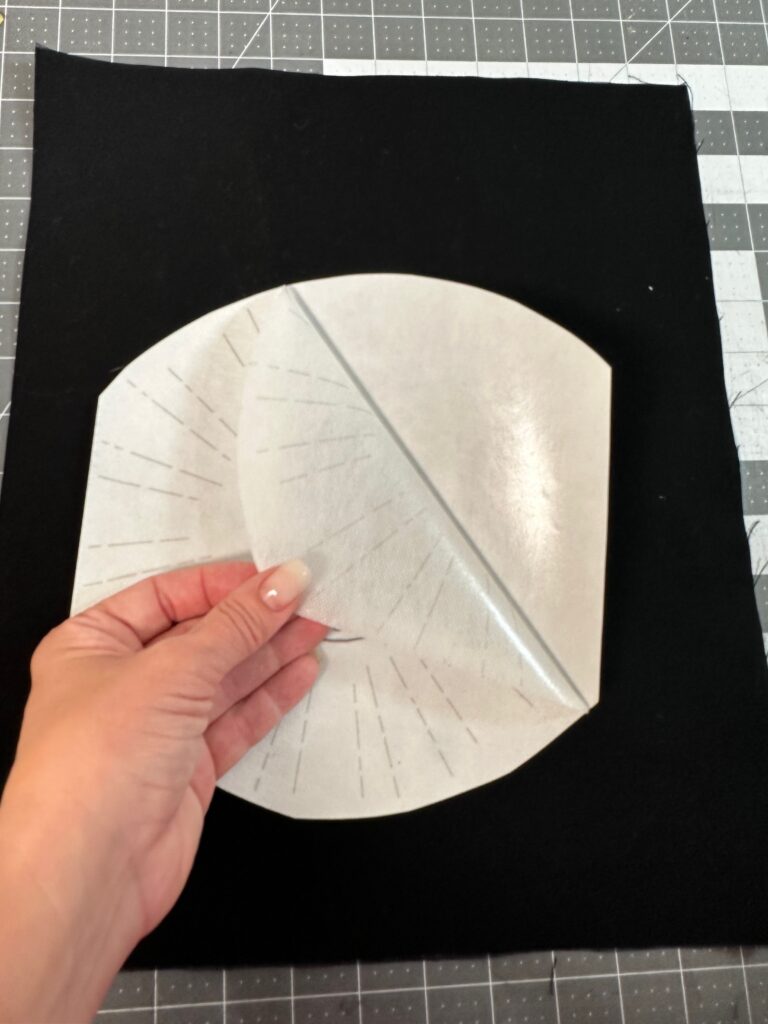 peeling off paper backing of template