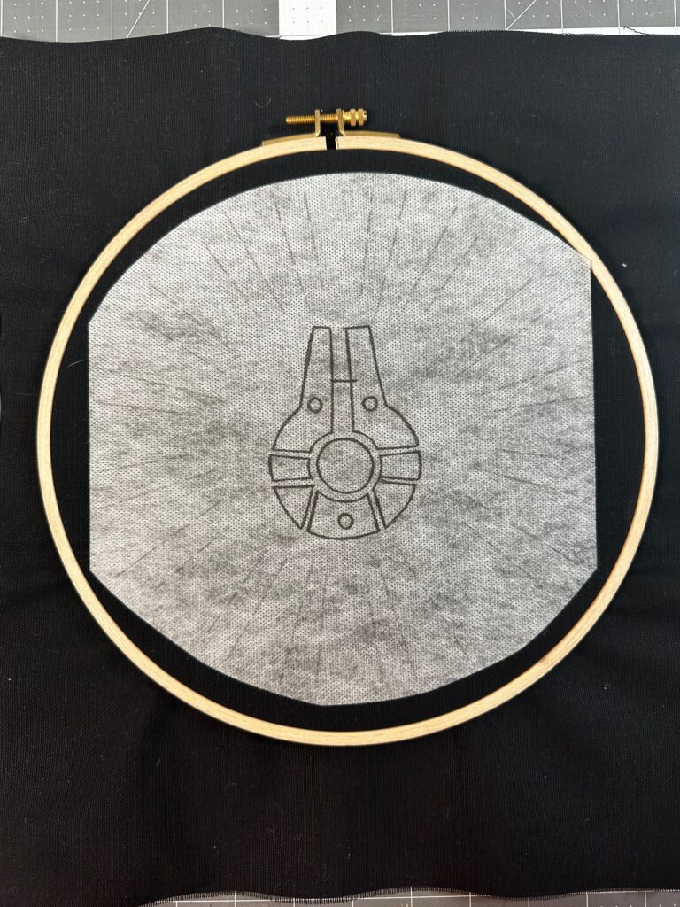 fabric hooped with Stick 'n Stitch template
