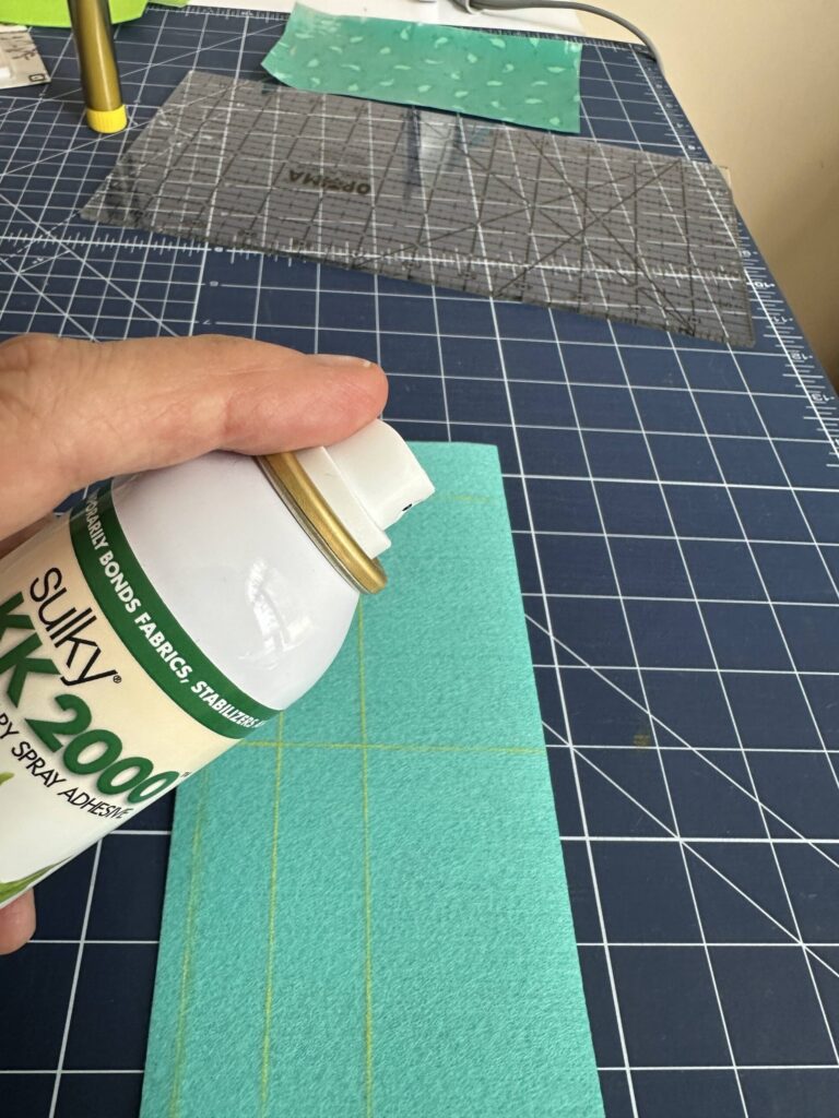 spraying wrong side of Felty with Temporary Spray Adhesive