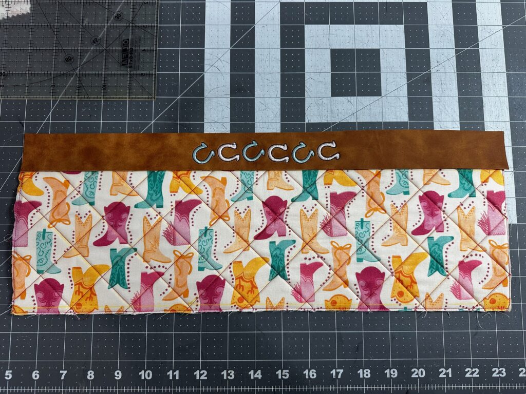 finished embroidery with quilted panel on Sabrina