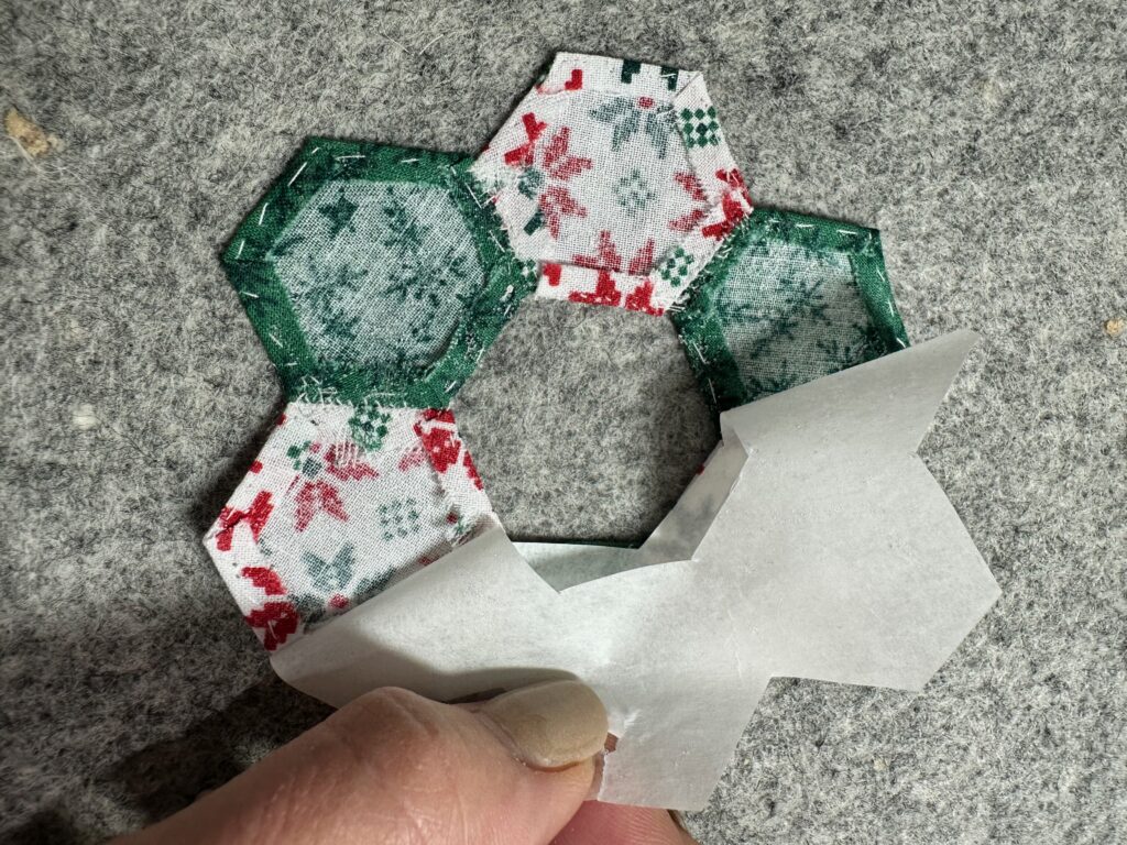 peeling off paper backing of fusible web