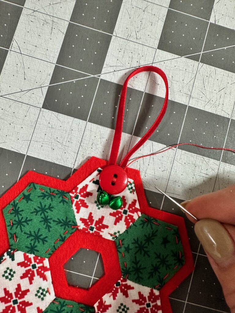 adding buttons and bells to top of hexi ornament