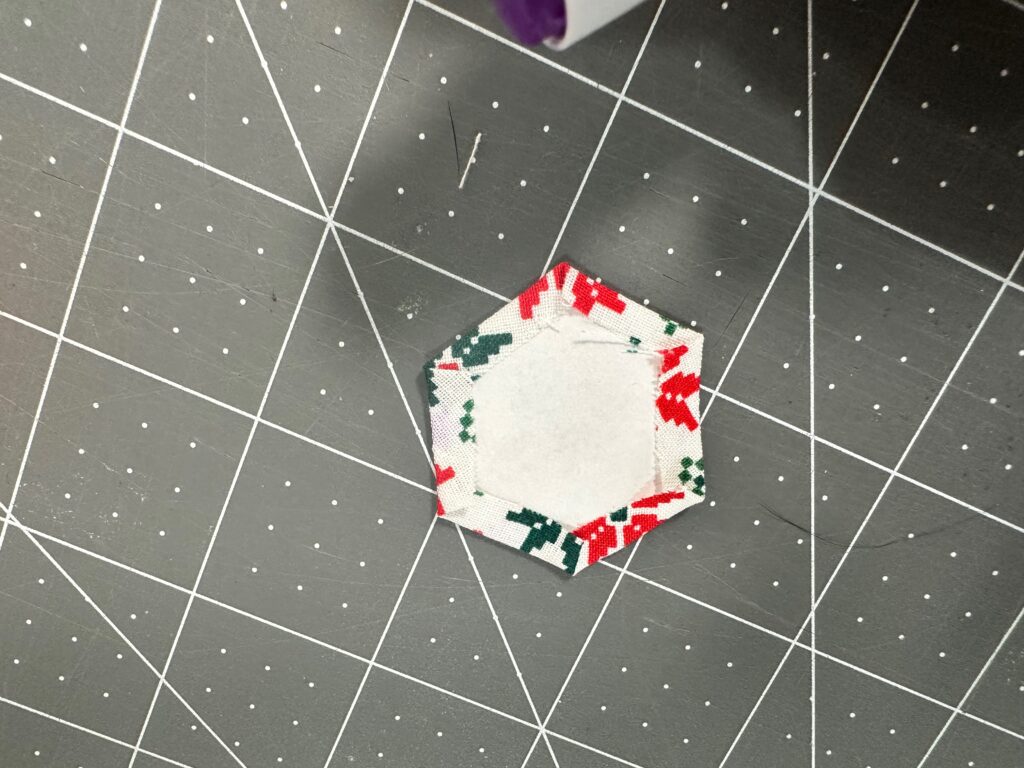 fabric secured around hexi paper shape