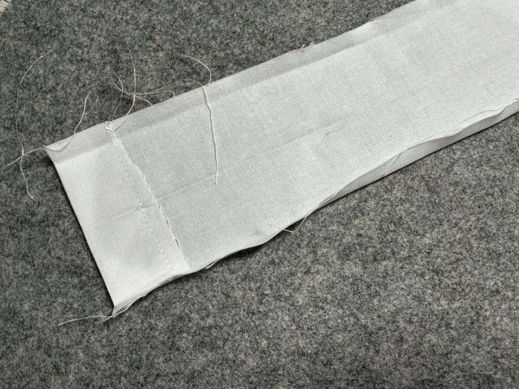 both long edges of casing folded