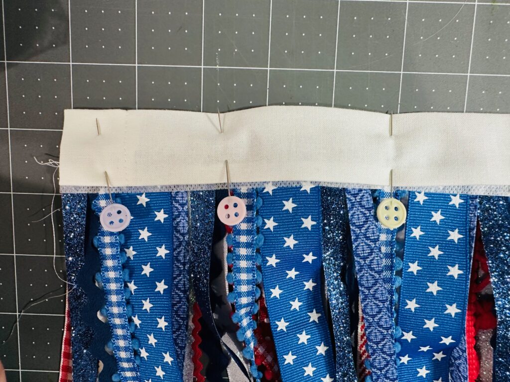 casing fabric pinned around ribbons