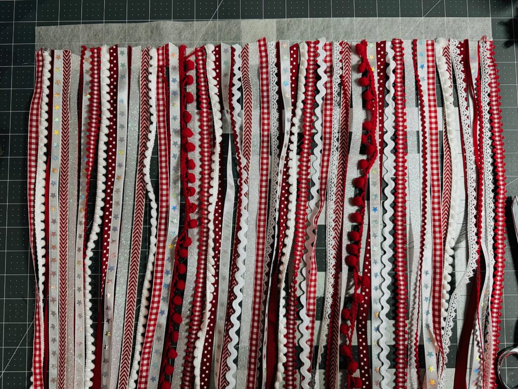 all red and white ribbons attached to Stick n Stitch