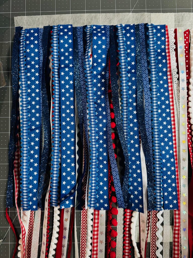 added blue ribbons to Stick 'n Stitch header