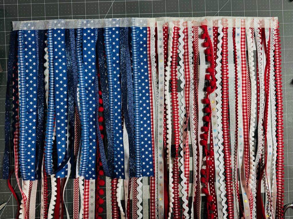 finished ribbon flag with stick 'n stitch header